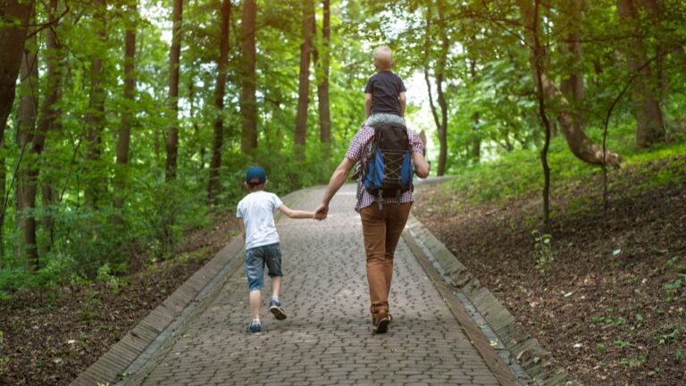 children walking with their dad